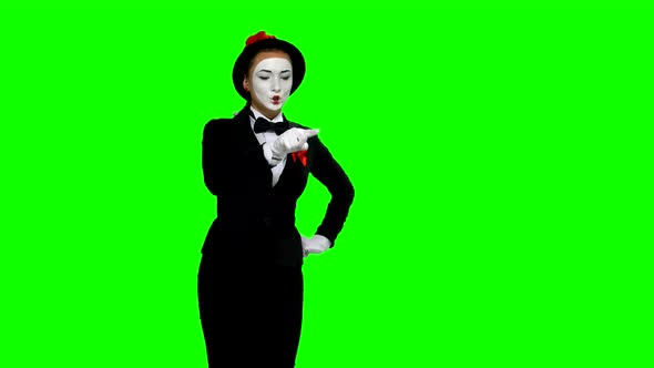 Woman Mime Writes Something in Air on Green Screen