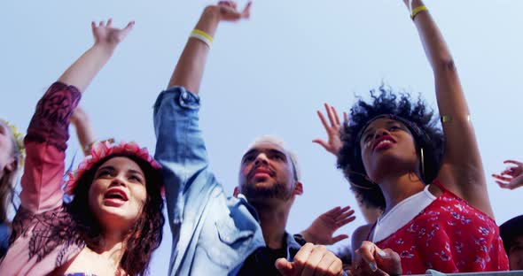 Group of friends dancing at music festival 4k