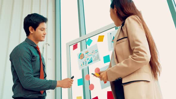 Business People Work on Project Planning Board