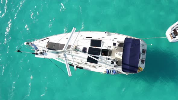 Mast Of Sailboat Swaying While Cruising On The Coast Of The Bahamas In Caribbean. - aerial