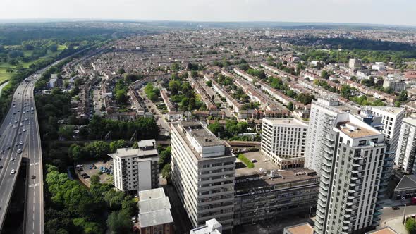 Panoramic aerial view of Ilford from North Circular road to the two tall towers on a sunny day