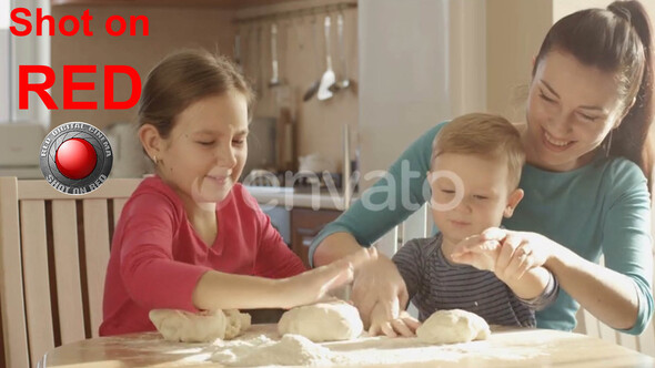 Happy Family Cooking Together In The Kitchen Playing With The Dough And Ingredients shot on RED