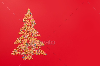 ful sweets over red background and copy space for your xmas greetings. Top view flat lay