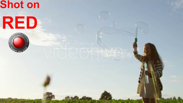 Childhood Happy Girl with Air Bubbles