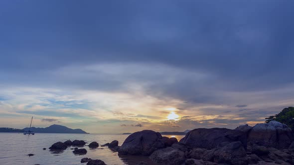 Time Lapse Sunrise Above The Rock By The Sea.