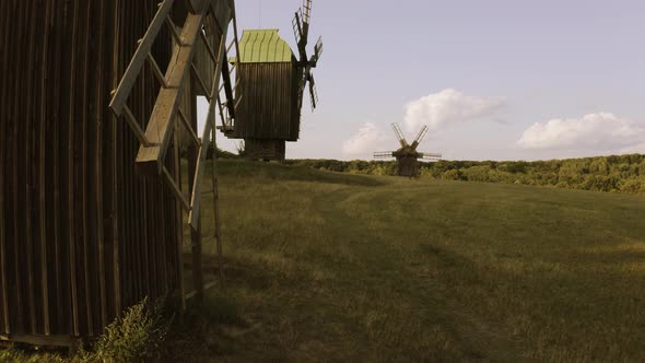 Landscape of Rustic Wooden Windmills on the Field