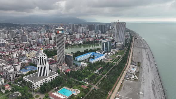 Aerial view of beautiful lake in the center of Batumi. flying over 6 May park. Georgia 2022 summer