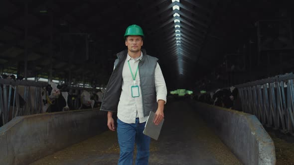 Farm Worker Walking Barn Alone