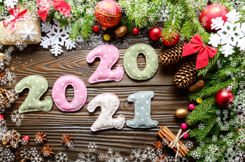 ric with Christmas decorations flat lay on wooden background