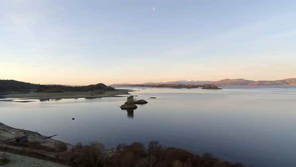 Ruins of Castle Stalker in Scotland and Beautiful Landscape