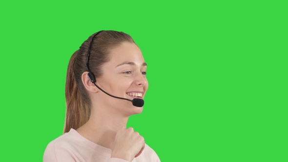 Beautiful call center operator with headset talking on