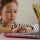 Little child girl is studying online at home - VideoHive Item for Sale