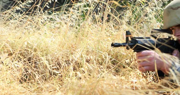 Military soldier during training exercise with weapon