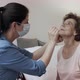 Nurse Swabbing Nose of Senior Female Patient for Coronavirus Test - VideoHive Item for Sale