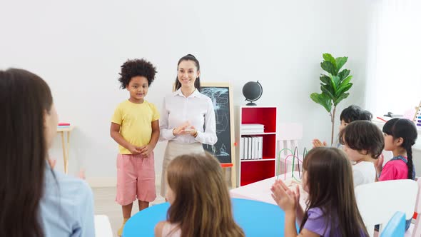 Asian beautiful young woman teacher teaching a lesson to kid at school.