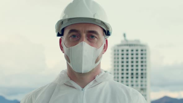 Portrait of a Professional Engineer of a Construction Industrial Company Wearing a Protective Mask