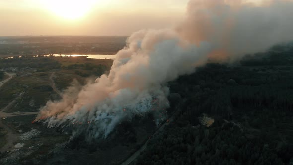 Aerial View at Big Fire at Garbage Dump, Burning Pollutes the Environment. Ecological Catastrophe