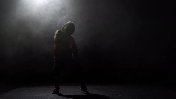 Silhouette of a Talented Young Break Dancer