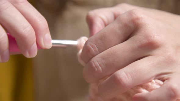 Closeup of Young Female Hands of a Caucasian Girl Doing Crochet Shows How to Knit Correctly