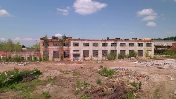 Old industrial territory. Abandoned buildings of ancient factory. Old brick pipes of industry. Aeria