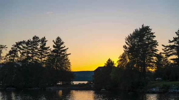 Colorful sunset over lake with beautiful vibrant colors and stars (4k)