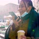 Young woman with face mask talking on smart phone on street, Italy - VideoHive Item for Sale