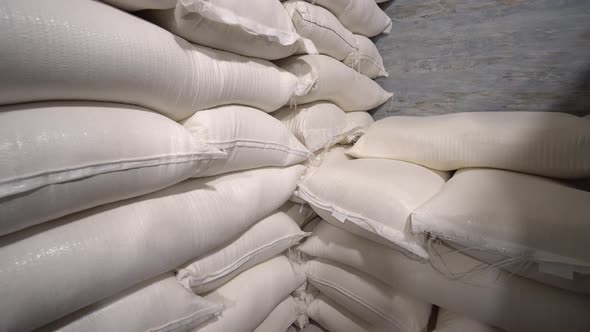 In stock, rice, sugar, cereals and flour are prepared in bags for shipment