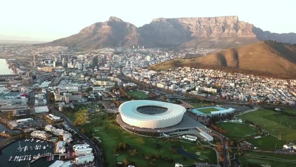  Aerial over city of Cape Town, South Africa with Table Mountain and the ocean