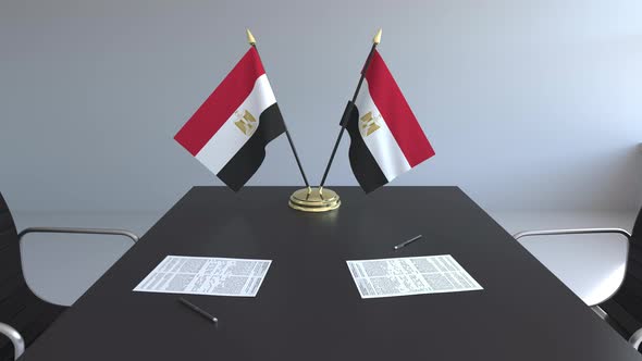 Flags of Egypt and Papers on the Table