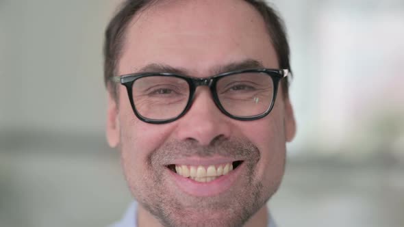 Close Up of Middle Aged Man Smiling at the Camera