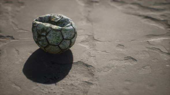 Old Soccer Ball the Cement Floor