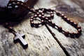 Rosary beads and crucifix cross on holy bible - PhotoDune Item for Sale