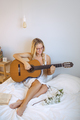 Girl Playing Guitar at Home - PhotoDune Item for Sale