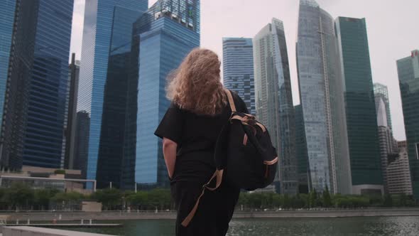 Travel in Singapore Woman Walks Near Downtown