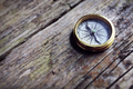Antique golden compass on wood background - PhotoDune Item for Sale