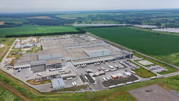 Aerial view of a modern industrial territory in the countryside. Huge manufacturing structure