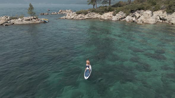 Man Paddles on the Board