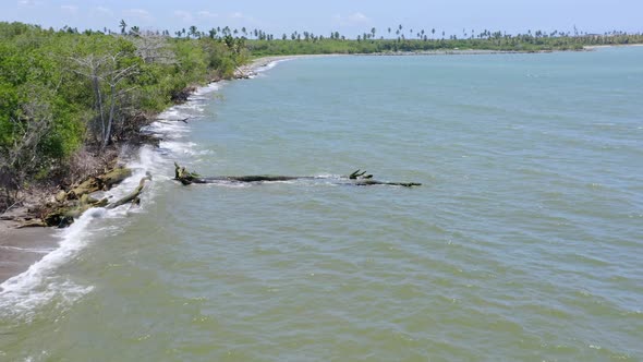 Drone flying over waters along mouth of Soco river, San Pedro de Macoris in Dominican Republic. Aeri