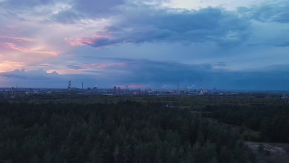 Aerial view of heavy and chemical industry plant at sunset background.