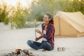 Woman Camping Near Campfire - PhotoDune Item for Sale