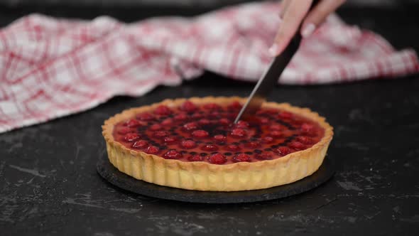 Cutting Berries Tart with Custard and Jelly