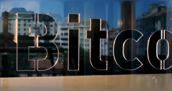 Glass Bitcoin Letters and Office in Background