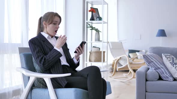 Shocked Wondering Woman While Using Smartphone