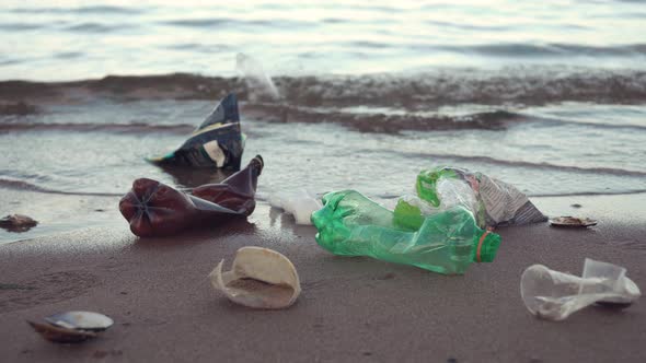 Plastic Garbage Lying on Seashore