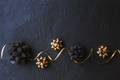 Gold and black bow for gift box on a black background. Christmas. - PhotoDune Item for Sale