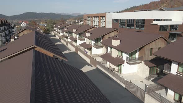 Flying over mountain resort Crystal in Bakuriani, Modern hotel in Georgian mountains