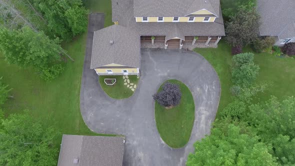 real estate aerial yellow family home tilt up reveal property 4k