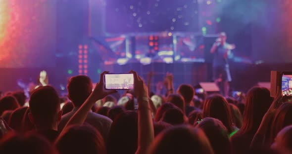 People Are Filming a Singer’s Concert on Smartphone. Сrowd of People at an Artist's Concert