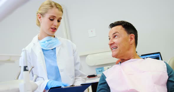 Dentist interacting with a male patient