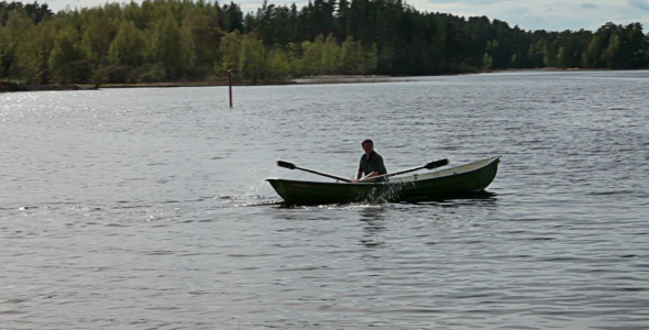 Rowing Boat Floats On The Lake